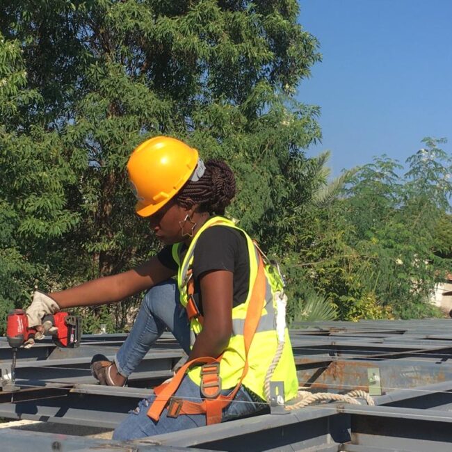 A women installer in 10Power's Haiti field training program